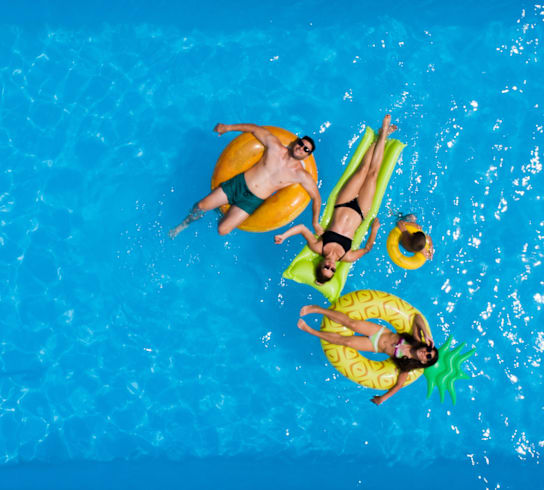 a group of people swimming in a pool