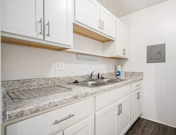 A kitchen with white cabinets at Normandy Village Apartments, Michigan City, Indiana