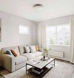 A living room with a couch, a coffee table, and a television.