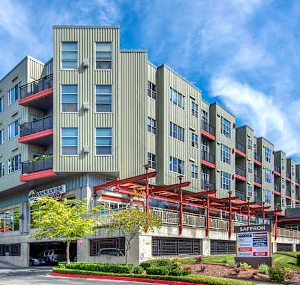 A large building with a red awning in front of it.