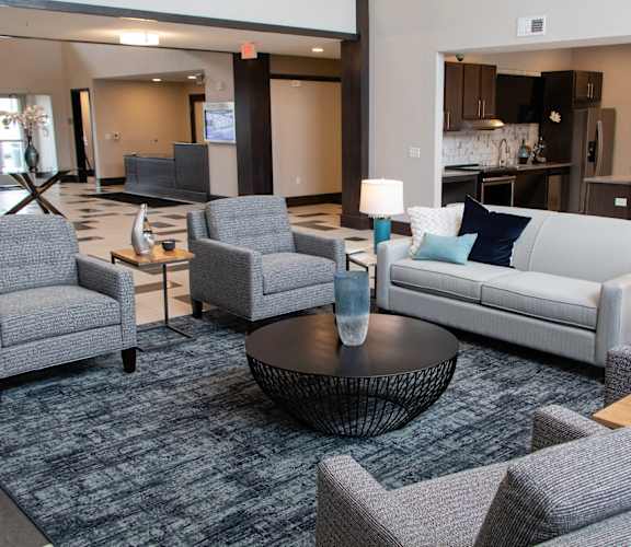 A living room with grey couches and a coffee table.