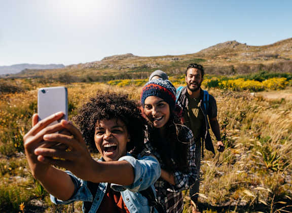 Sagecliff Apartments Group of Hikers Taking Selfie in Field