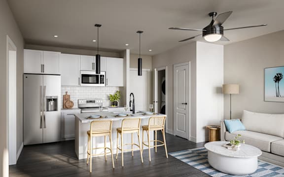 A modern kitchen with a dining table and chairs.