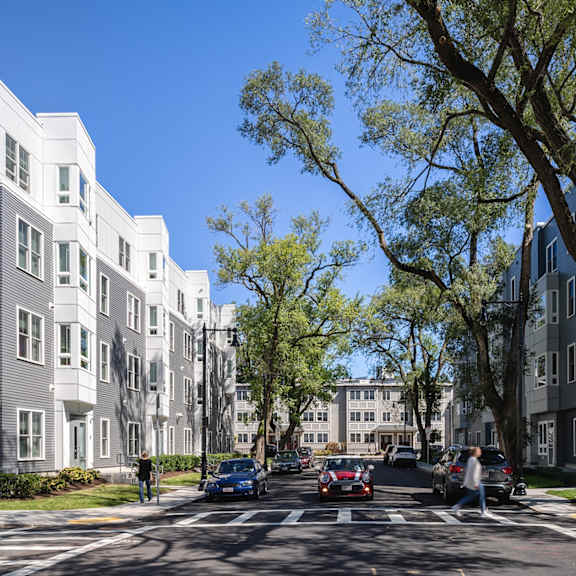 a rendering of a new apartment building on a city street at The Anne M. Lynch Homes at Old Colony, Massachusetts, 02127