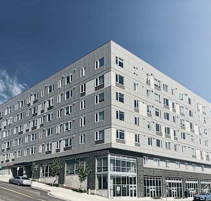 a large white building with many windows on the side of a road at Jefferson Yards, Tacoma, WA 98402
