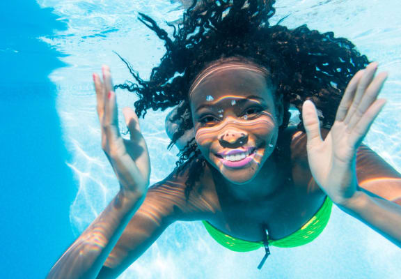 Woman Swimmer Underneath Water in Pool
