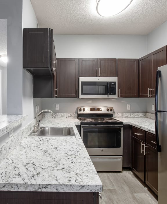 Kitchen with breakfast bar at Centennial Crossing Apartments in Nashville Tennessee
