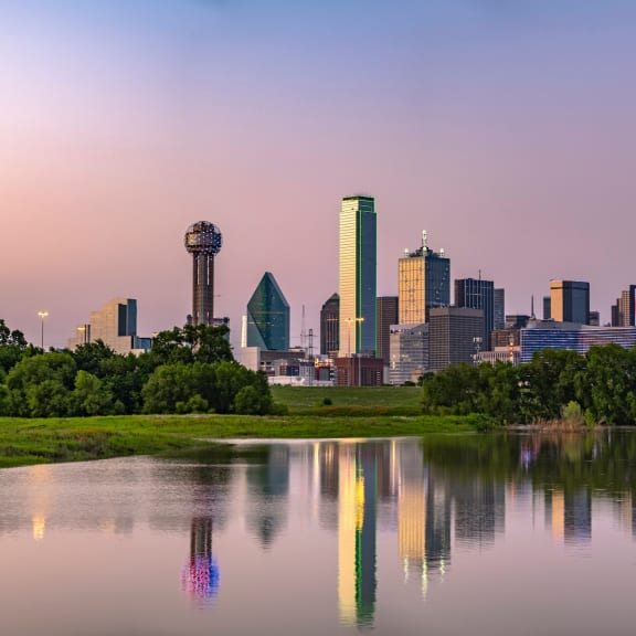 a view of the dallas skyline at sunset