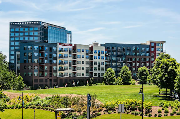 a park in front of some buildings