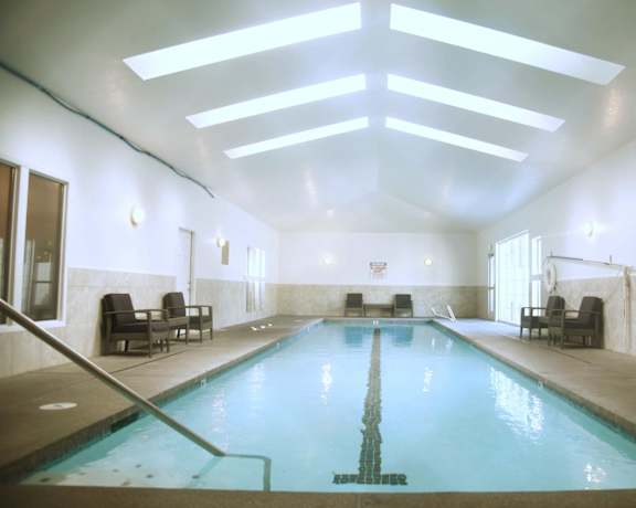 A large indoor swimming pool with a skylight above it at Graymayre Crossing Apartments, Spokane, WA, 99208