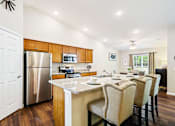 Thumbnail 3 of 7 - Greer SC Apartment Rentals Redwood Greer Ashburton Drive Kitchen To Dining Redwood Apartment Neighborhoods