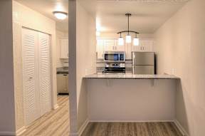 Wood-style flooring is a designer touch in the kitchen.