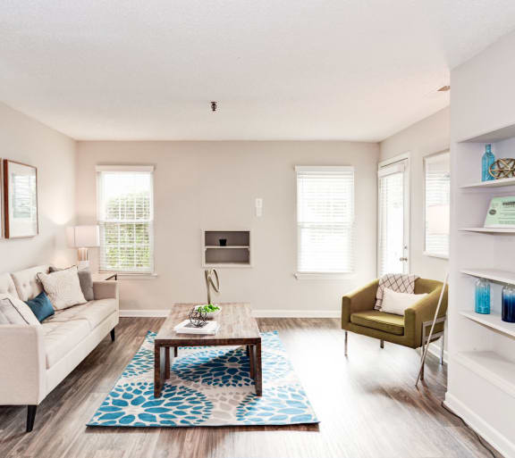 a living room with white walls and hardwood floors at Hamilton at Kings Place, Columbia