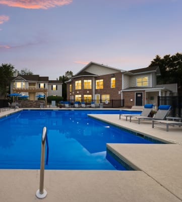 Chace Lake Villas resort-style swimming pool and back of the clubhouse at twilight
