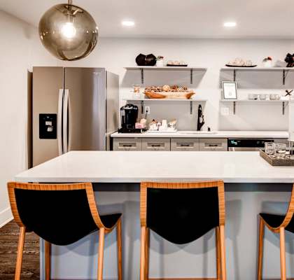 a kitchen with a large center island with a white countertop at Hamilton at Kings Place, Columbia, 21046