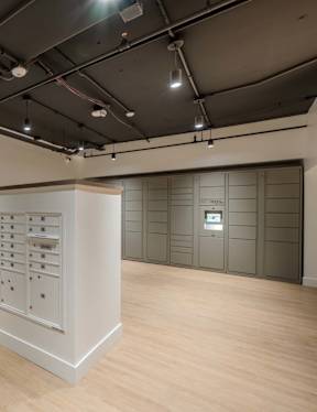 A room with a window and wooden flooring.