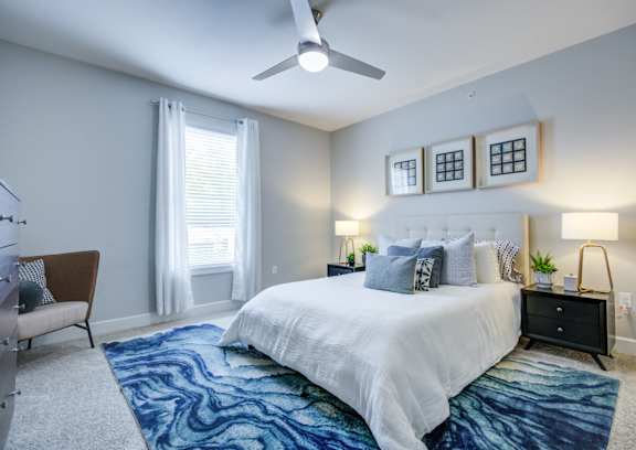 Bedroom with a Ceiling Fan at McKenzie Park Apartments, Little Rock, Arkansas