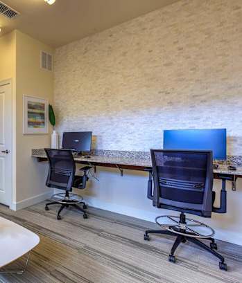 two computers on a desk in an office at Lake Lofts at Deerwood, Florida, 32216