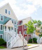 a blue house with a white truck parked in front of it