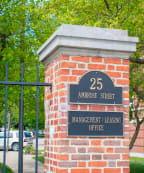 a brick pillar with a sign that reads 25 anderson street