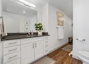 Thumbnail 13 of 20 - Bathroom with white cabinets and toilet and a sink at City View St. George, Utah, 84770