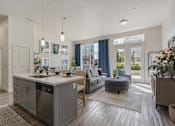 Thumbnail 8 of 21 - Modern kitchen with a dining area and a living room at 200 City View, Provo