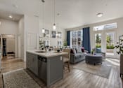 Thumbnail 3 of 21 - Modern kitchen with a large island and a dining area at 200 City View, Provo, Utah