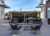 Thumbnail 42 of 49 - Patio with a table and chairs under a wooden pergola1 at 200 City View, Utah, 84601