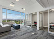Thumbnail 34 of 42 - A spacious office room with a view of the cityscape outside the large windows. 605 Place Student Housing & Co-Living, St George