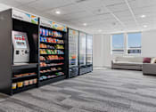 Thumbnail 32 of 42 - A vending machine is located in a room with a couch and a window. 605 Place Student Housing & Co-Living, St George, 84770