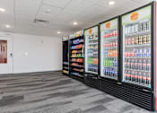 Thumbnail 33 of 42 - A room with a wall of drinks and a door on the left. 605 Place Student Housing & Co-Living, Utah