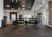 Thumbnail 36 of 42 - A gym with a variety of equipment including weights and cardio machines. 605 Place Student Housing & Co-Living, St George, UT 84770