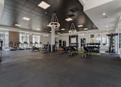 Thumbnail 40 of 42 - A gym with a variety of exercise equipment. 605 Place Student Housing & Co-Living, Utah