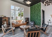 Thumbnail 22 of 42 - A living room with a green wall and a sofa. 605 Place Student Housing & Co-Living, St George