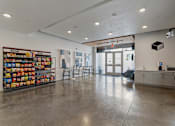 Thumbnail 26 of 62 - A room with a white ceiling and a wall of snacks.
