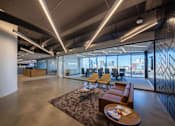 Thumbnail 24 of 24 - A modern office space with a large window overlooking the city.