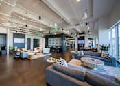 Thumbnail 4 of 24 - A modern open-plan office space with a mix of seating areas and collaborative workstations.