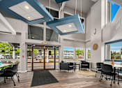 Thumbnail 5 of 8 - A modern office space with a view of the outside.