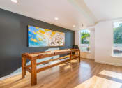 Thumbnail 1 of 19 - shuffle board table inside indoor lounge