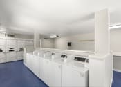 Thumbnail 10 of 21 - Oakridge Apartments - Laundry Room