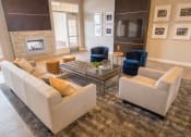 Thumbnail 28 of 49 - Clubhouse Living with couch at Skye at Arbor Lakes Apartments, Minnesota, 34105