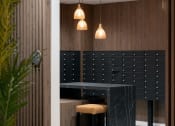 Thumbnail 2 of 19 - a black table and chairs in a room with wooden walls