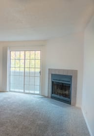 Living room with fireplace at Apple Creek Apartments