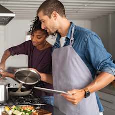Couple Cooking at The Lucille Apartments, Stuart, FL
