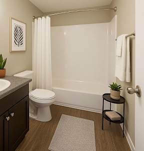 A bathroom with a white toilet and a white shower curtain.
