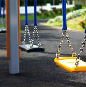 a set of swings on a playground
