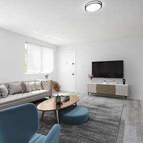 a living room with couches a coffee table and a television