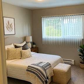 A room with a sliding glass door and a wooden floor.