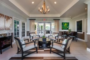 a living room filled with furniture and a chandelier