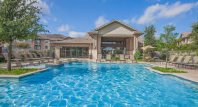 the estates at tanglewood|pool with clubhouse in background at Ovation at Lewisville Apartments, Texas , 75067